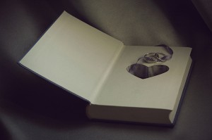 heart and rings inside book